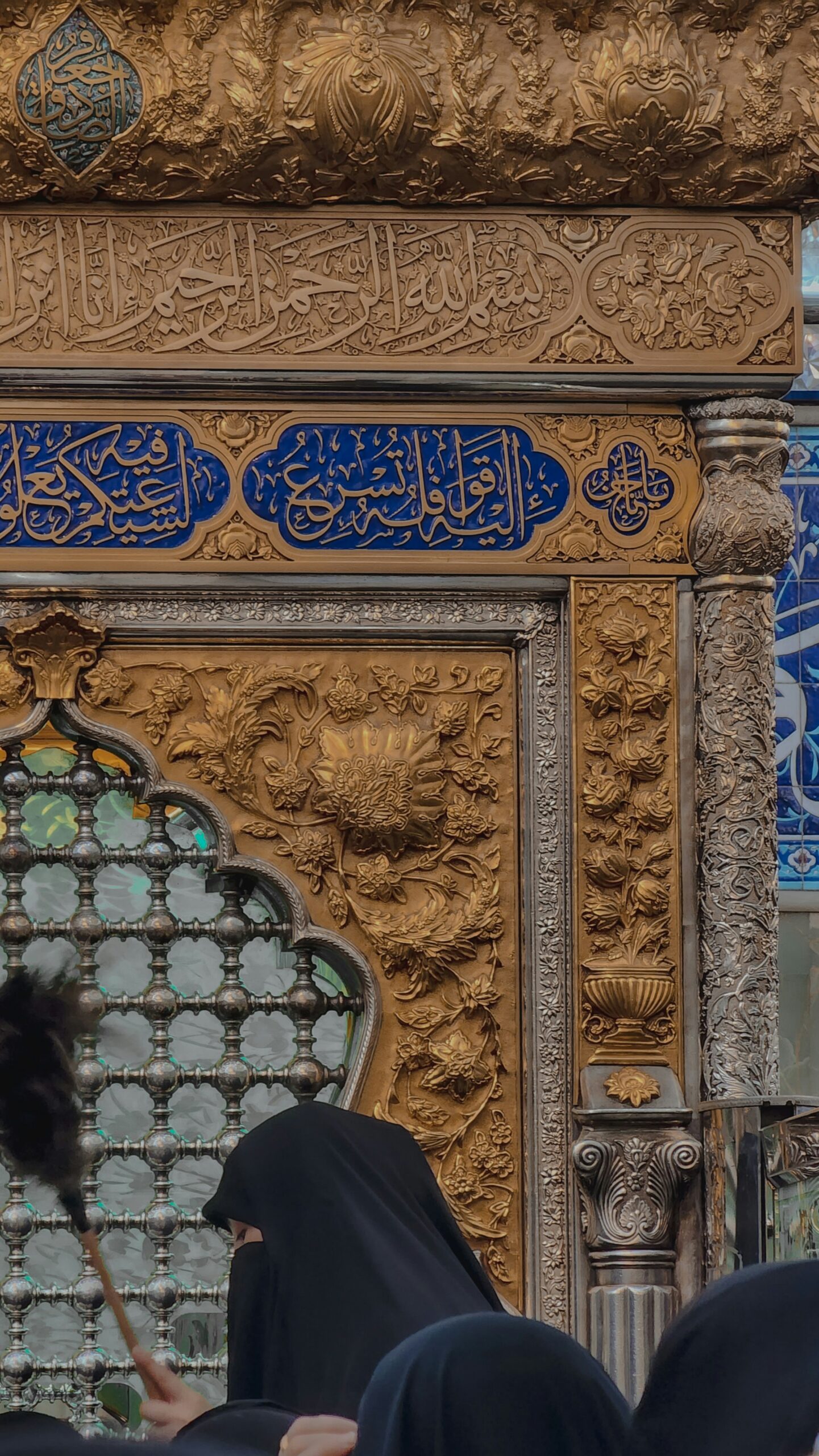 https://unsplash.com/photos/a-woman-in-a-black-hijab-standing-in-front-of-a-building-zDdr9cLsdEU